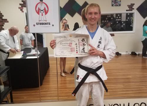 Steven with his IUKF Shodan Certificate and new Black Belt